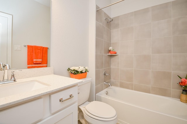 full bathroom with tiled shower / bath combo, vanity, and toilet