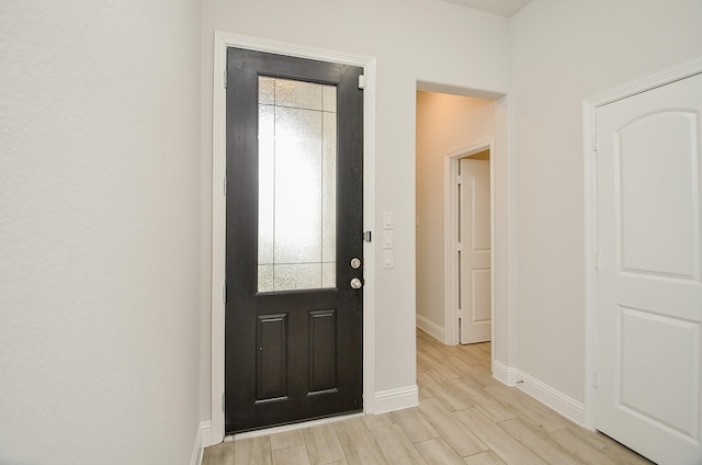 entryway with light hardwood / wood-style flooring