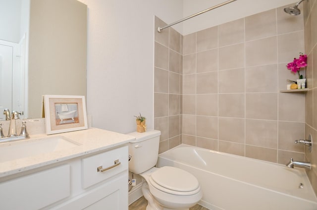 full bathroom with tiled shower / bath combo, vanity, and toilet