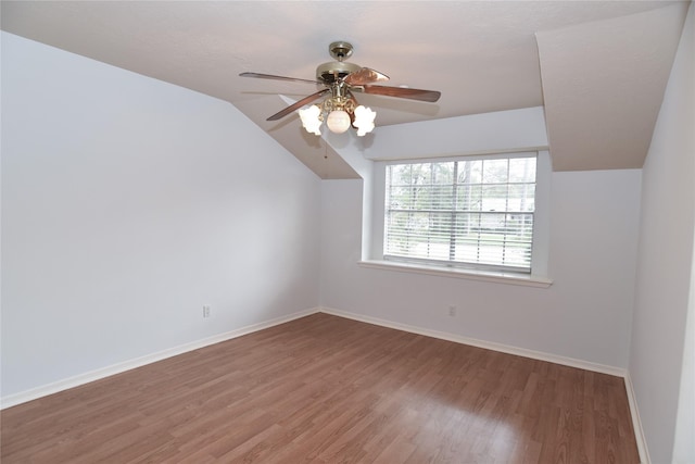 bonus room featuring hardwood / wood-style flooring, vaulted ceiling, and ceiling fan