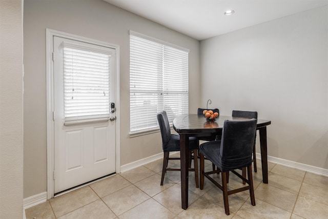 dining space with light tile patterned flooring