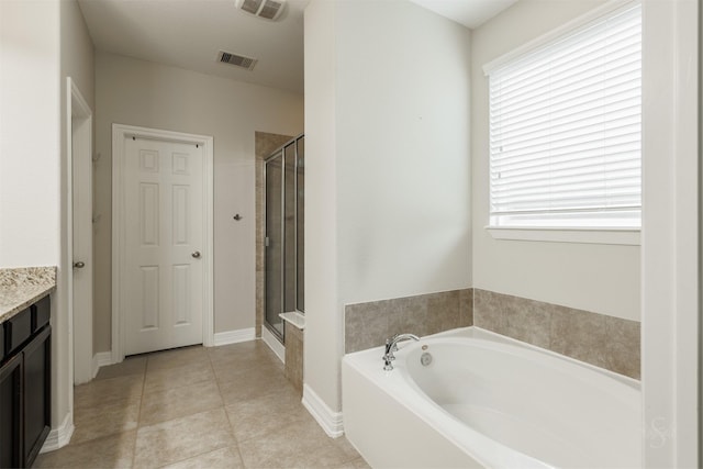 bathroom with vanity, tile patterned floors, and separate shower and tub