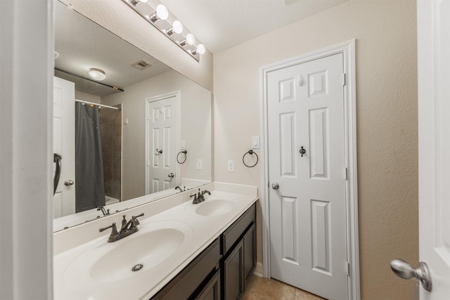 bathroom with vanity and shower / bath combo with shower curtain