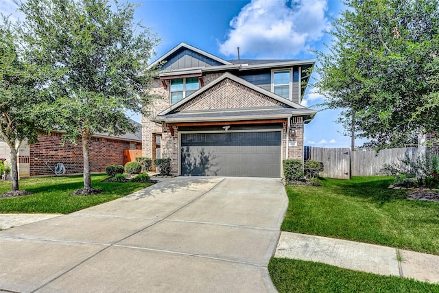 view of front of home with a garage and a front yard