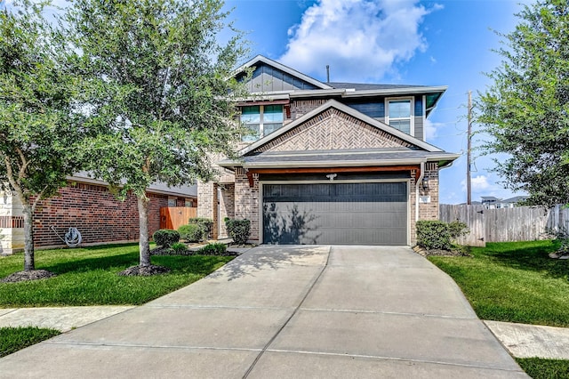 view of front of home featuring a garage and a front lawn