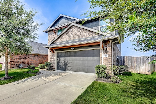 view of front of property featuring a garage and a front yard