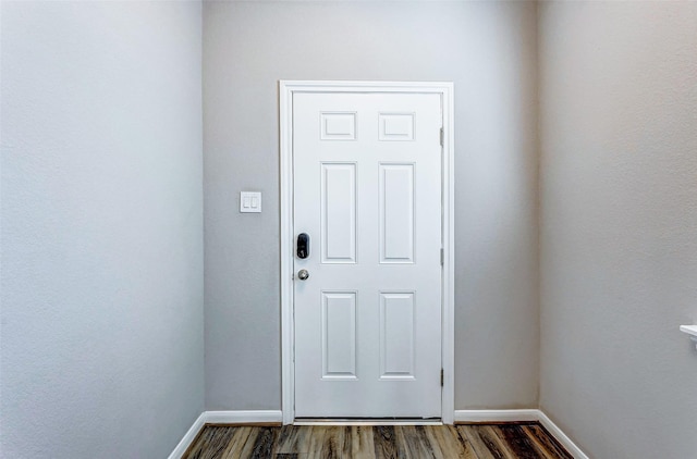 doorway with dark hardwood / wood-style flooring