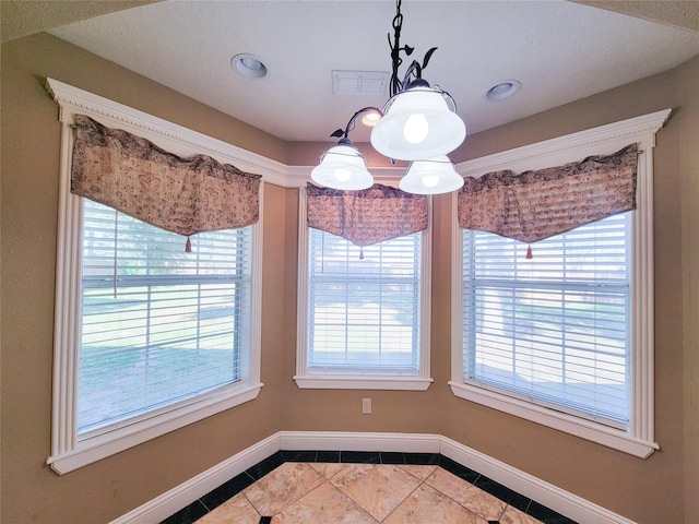 unfurnished dining area with tile patterned floors