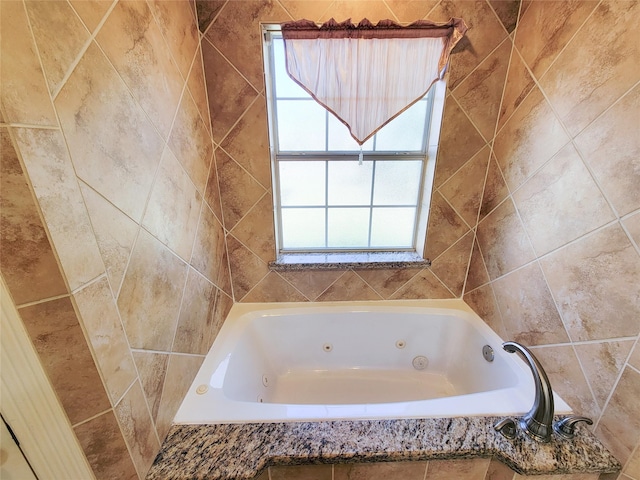 bathroom with tiled tub