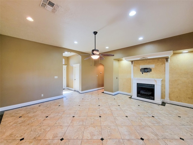 unfurnished living room featuring ceiling fan