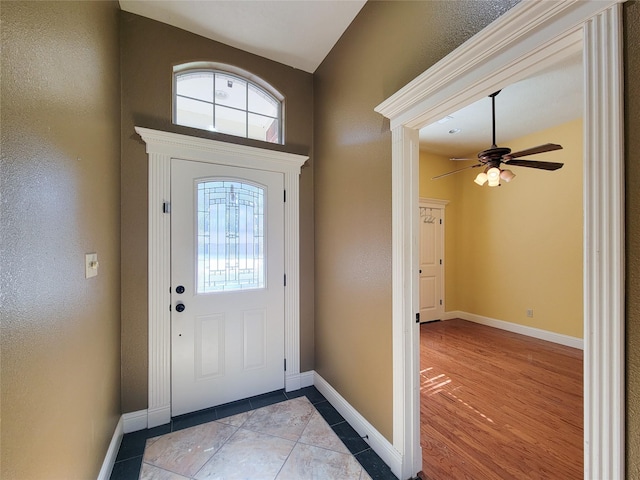 foyer featuring ceiling fan and light hardwood / wood-style floors