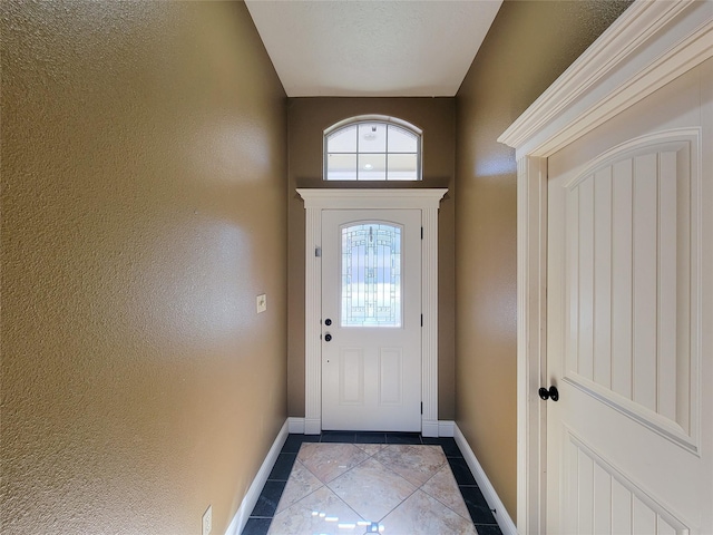 doorway featuring light tile patterned floors