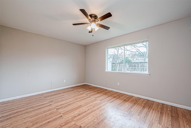 unfurnished room featuring ceiling fan and light wood-type flooring