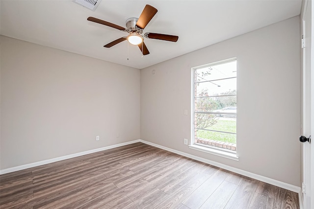 unfurnished room featuring hardwood / wood-style floors and ceiling fan