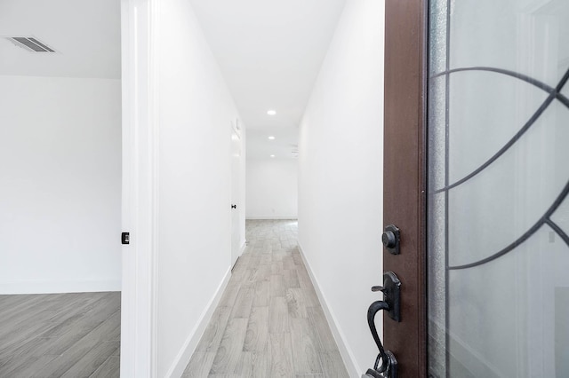 hallway featuring light hardwood / wood-style flooring