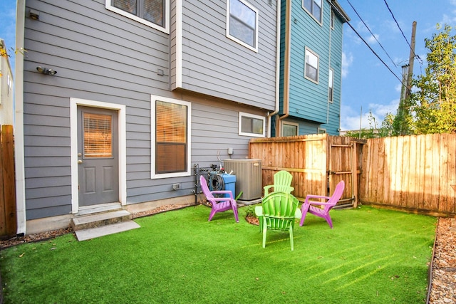 exterior space with a fenced backyard and central AC