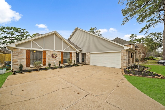 view of front of home with a garage and a front lawn