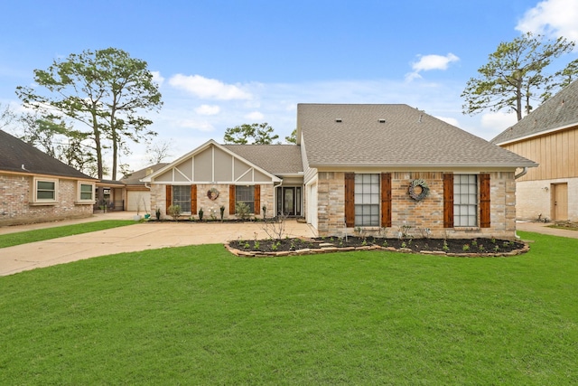 view of front of home with a garage and a front lawn