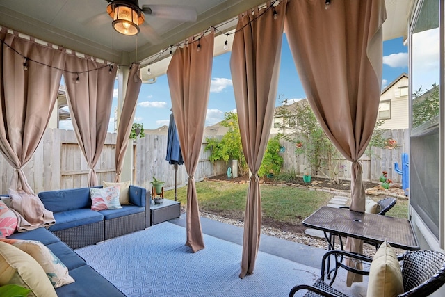 view of patio featuring an outdoor living space and ceiling fan