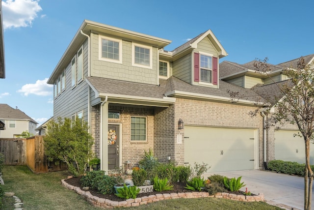 view of front of house featuring a garage and a front yard