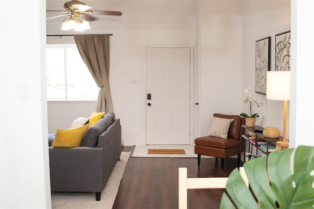 living room with ceiling fan and light hardwood / wood-style flooring