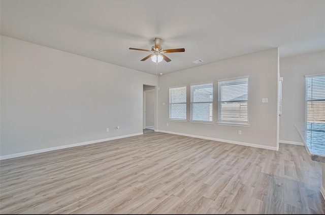 unfurnished room with ceiling fan and light hardwood / wood-style flooring