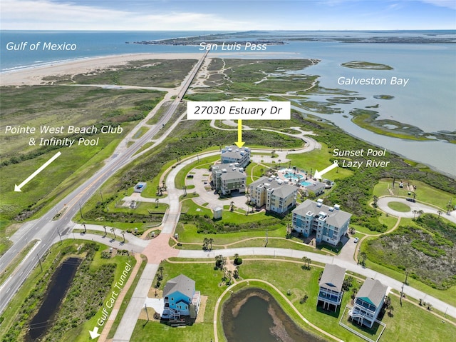 drone / aerial view with a view of the beach and a water view