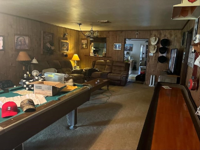 game room featuring an inviting chandelier and carpet floors