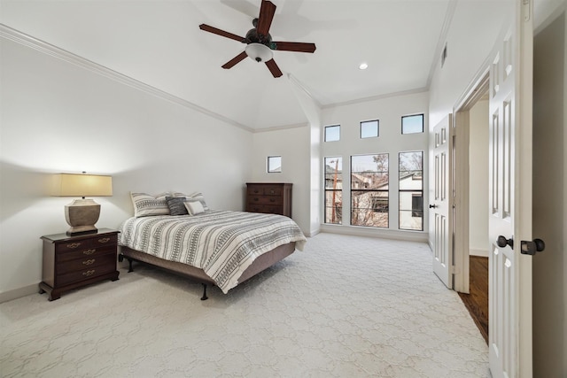 bedroom featuring crown molding, light colored carpet, and ceiling fan