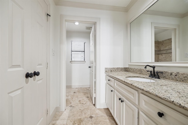 bathroom featuring vanity and ornamental molding