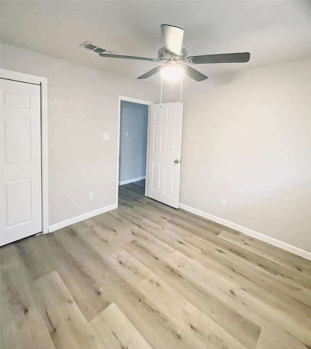 unfurnished bedroom featuring ceiling fan and light wood-type flooring