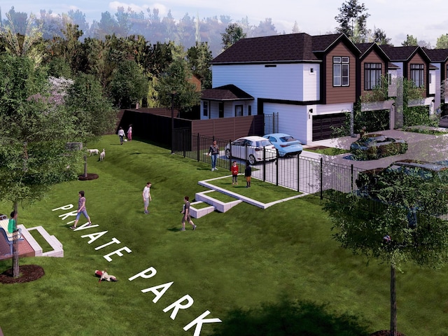 view of yard featuring an attached garage, fence, and concrete driveway