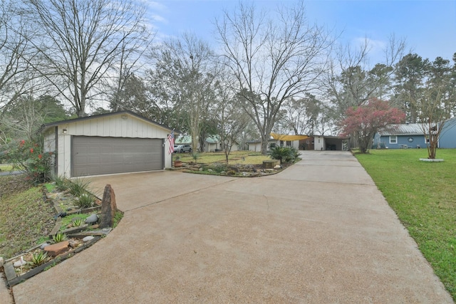 view of front of property with a front lawn and a garage