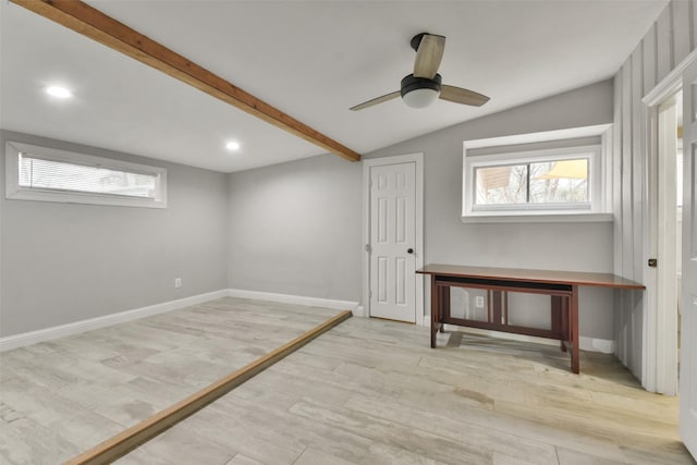 basement with light wood-type flooring and ceiling fan