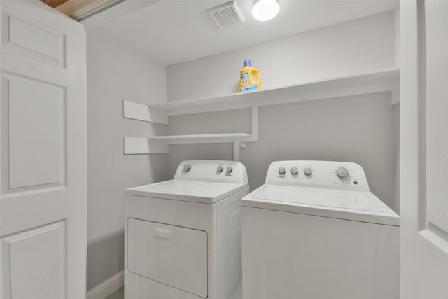 laundry area with washer and clothes dryer