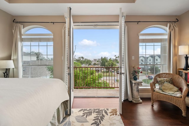 bedroom with hardwood / wood-style flooring