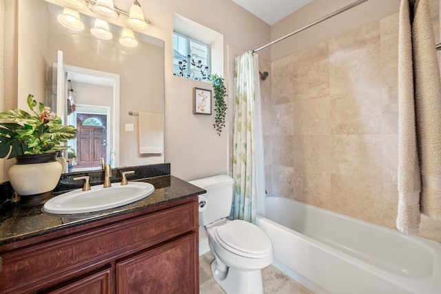 full bathroom featuring vanity, shower / bath combo, and toilet