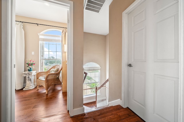 doorway to outside featuring dark wood-type flooring