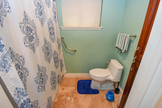 bathroom featuring tile patterned floors and toilet