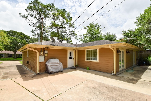 ranch-style home with a patio