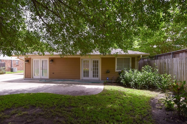 back of property featuring central AC unit, a patio area, and french doors