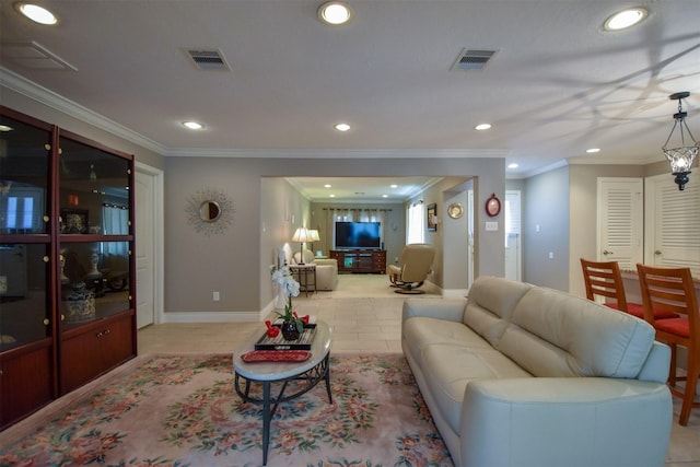 living room featuring light tile patterned floors and crown molding