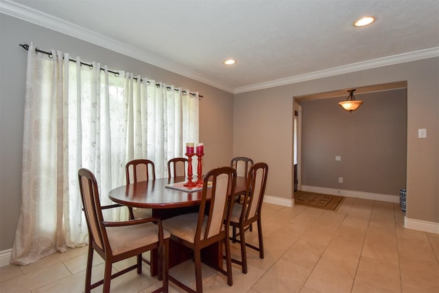 tiled dining area featuring ornamental molding