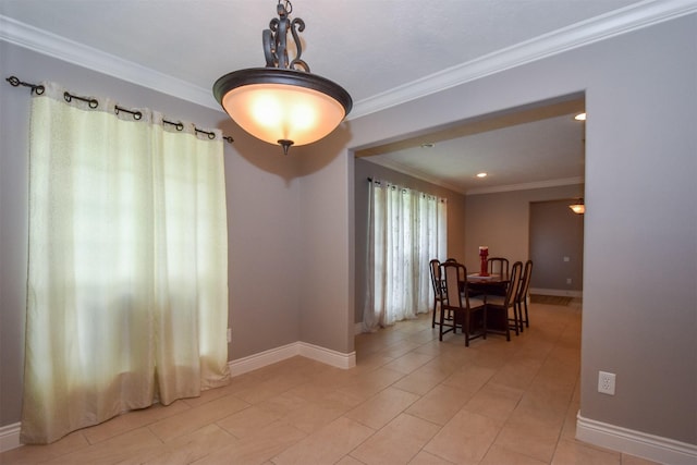 tiled dining room with crown molding