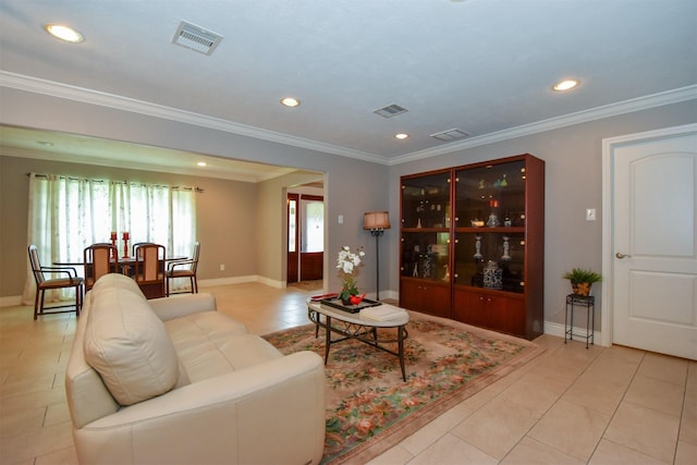 living room featuring crown molding and light tile patterned floors