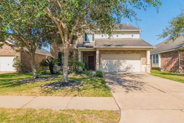 view of front of property featuring a garage and a front lawn