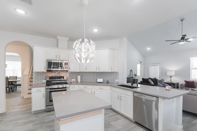 kitchen with white cabinetry, appliances with stainless steel finishes, and sink