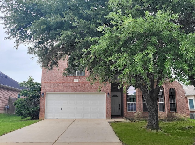 9210 Hidden Lake E Lake E, Magnolia, TX 77354 - view of property hidden behind natural elements with a front yard, a garage, brick siding, and driveway