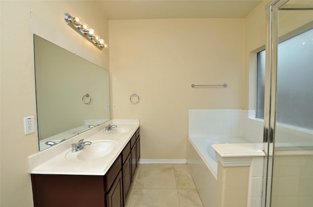 9210 Hidden Lake E Lake E, Magnolia, TX 77354 - bathroom featuring a sink, double vanity, a bath, and tile patterned floors