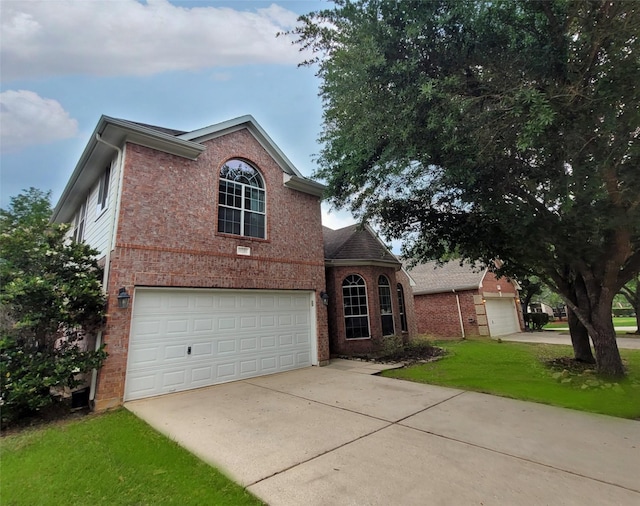 9210 Hidden Lake E Lake E, Magnolia, TX 77354 - traditional home with driveway, brick siding, a front lawn, and a garage